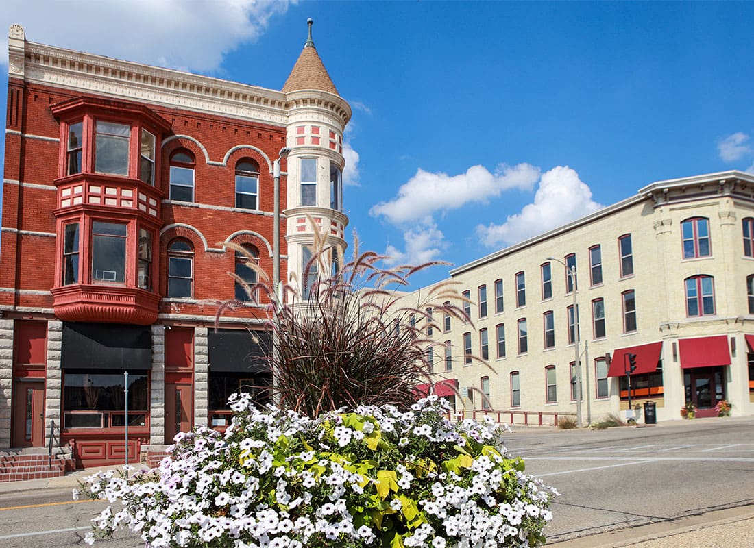 Janesville, WI - View of Commercial Buildings Along the Main Street on a Sunny Day in Downtown Janesville Wisconsin